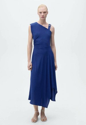 Asymmetrical blue dress with a one-shoulder design, soft fabric, draped silhouette, and a decorative button accent on the shoulder.