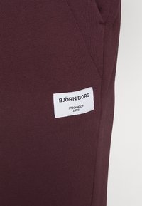 Björn Borg CENTRE TAPERED PANTS - Calças de fato de treino - fudge