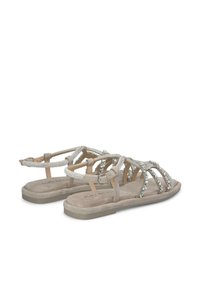 Silberfarbene Riemchensandalen mit flachem Fußbett, verziert mit Strasssteinen, ausgestattet mit einer Schnallenverschluss und weichem, samtigem Material.