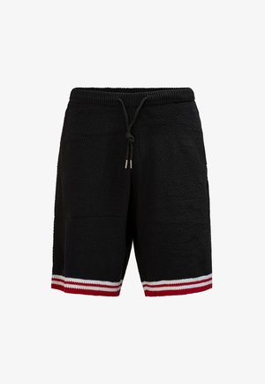 Schwarze gestrickte Shorts mit elastischem Bund, Kordelzug und rot-weißen Streifen am Saum.