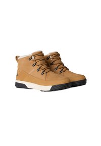 Brown suede ankle boots with a white fleece lining, black laces, and molded rubber outsole, featuring a sleek, modern design.