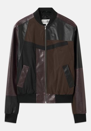 Bomber jacket made of leather and nylon in shades of brown, black, and burgundy; features ribbed cuffs, a front zipper, and color-block design.