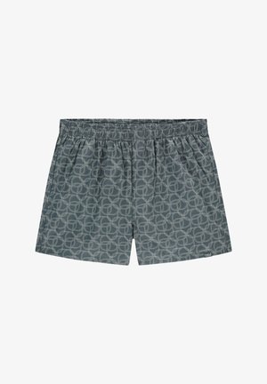 Un boxer en tissu gris foncé avec un motif circulaire blanc intégral, une taille élastique et une texture douce.