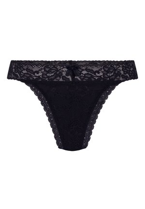 Black lace thong featuring a floral pattern, scalloped edges, and a central bow detail at the front. Soft, sheer texture throughout.