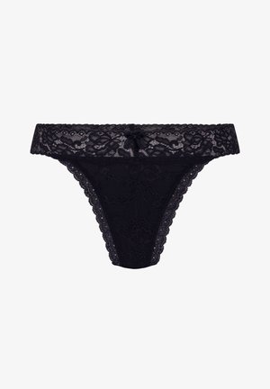 Black lace thong featuring a floral pattern, scalloped edges, and a central bow detail at the front. Soft, sheer texture throughout.