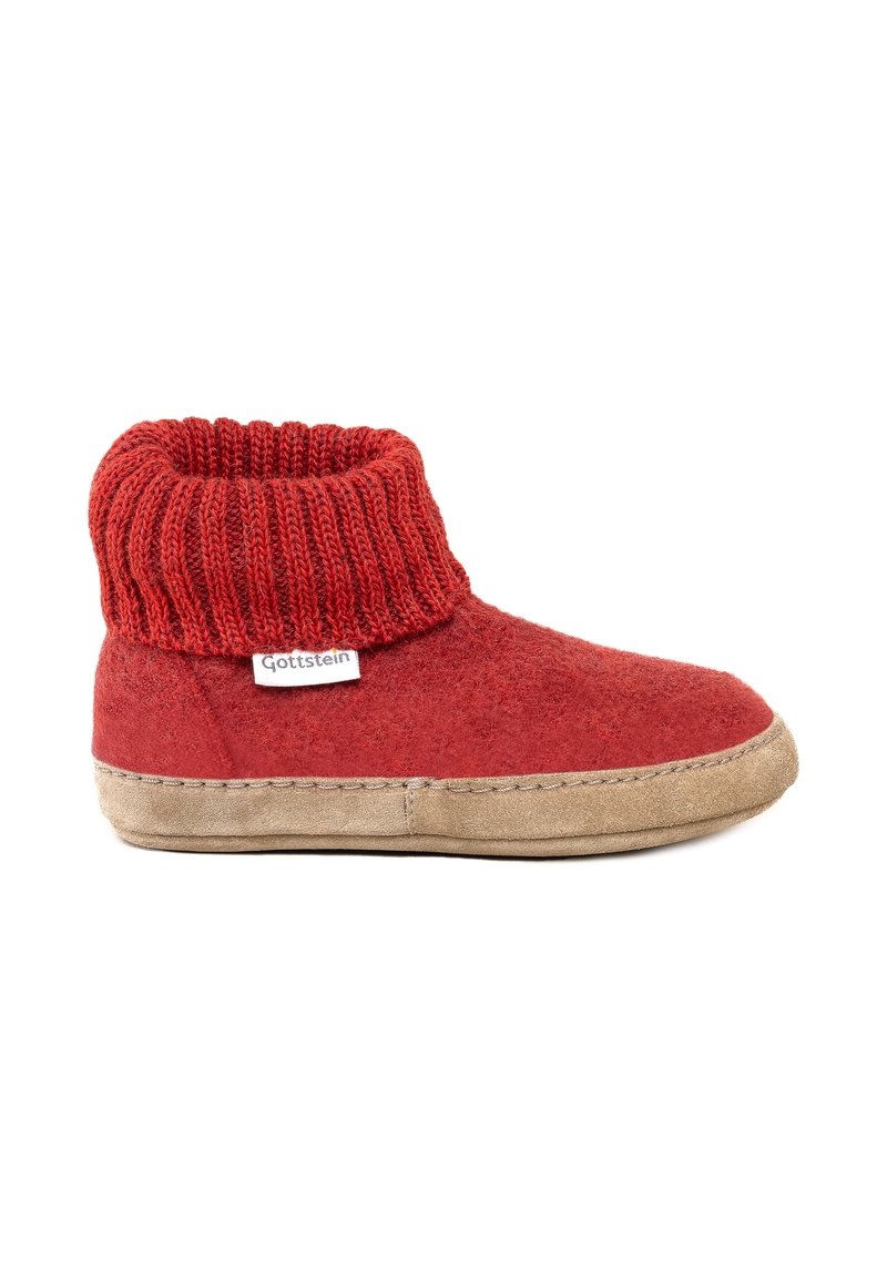 Rød tøffel med strikket manchet og beige sål, mærket "Gottstein," designet til indendørs komfort og varme.