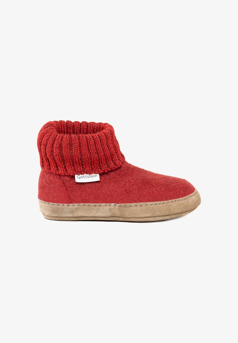 Pantofole rosse con risvolto lavorato a maglia e suola beige, etichettate "Gottstein", progettate per comfort e calore indoor.