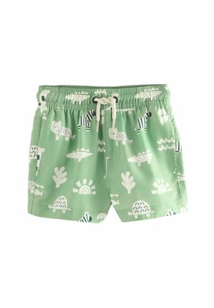 Maillot de bain vert avec divers motifs d'animaux et de nature blancs. Taille élastique avec cordon de serrage. Tissu doux et léger.
