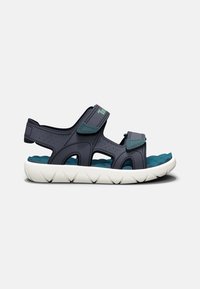 Sandali blu navy con cinturini regolabili in Velcro, design a fori e soletta con trama acquatica. Suola bianca con motivo a onda per garantire aderenza.