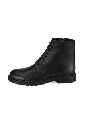 Botte de cheville en cuir noir avec un bout arrondi, un laçage à l'avant et une surface texturée. Semelle en caoutchouc avec un talon plat.