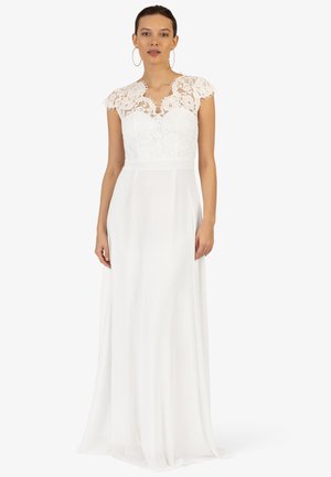 Witte jurk met een kant bodice met kapmouwen, vloeiende rok en een aangesloten taille, wat een elegante silhouet creëert.