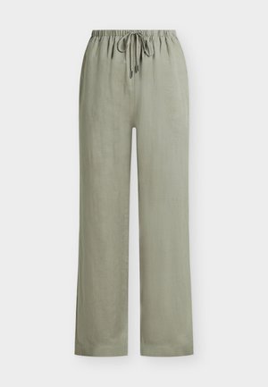 Pantalon large vert clair avec taille élastique et cordon de serrage à l'avant, fabriqué en tissu léger et texturé.