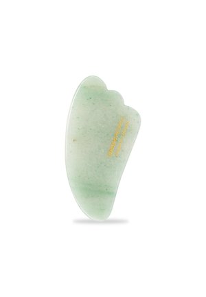 Green jade stone gua sha tool with a smooth surface, curved edges, and a natural green color. Features golden text on one side.