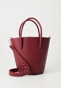 Red textured leather bucket bag with double handles and detachable shoulder strap embossed with brand name.