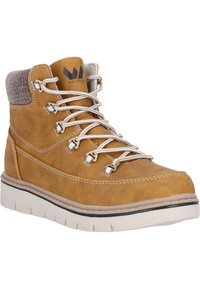 Brun läderankelsko med en vadderad grå krage, vita snören, guldfärgade detaljer och en tjock vit gummisula. Stygn-detaljer genom hela skon.