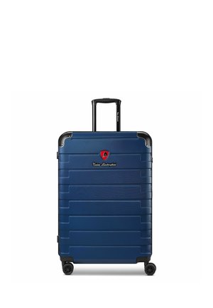 Harde marineblauwe koffer met telescopische hendel, vier wielen en Tonino Lamborghini-logo aan de voorkant.