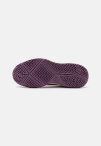 Sole of a shoe featuring a lavender rubber material with a herringbone pattern for traction and a smooth textured area near the heel.