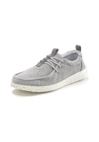 Graues Textilschuh mit runder Zehe, ausgestattet mit elastischen Schnürsenkeln und einer strukturierten, weiß gepunkteten Sohle. Rückenteil für ein einfaches Anziehen.