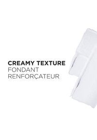 Romige textuurproduct, voornamelijk wit, met een glad oppervlak en afgeronde hoeken. Tekst toont duidelijk "Romige Textuur" in vetgedrukt lettertype.