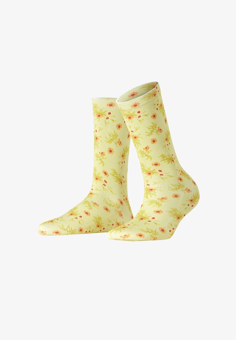 Kniestrümpfe aus weichem Stoff mit einem hellgelben Hintergrund und einem Blumenmuster in Pink und Grün. Strukturiertes Strickdesign.