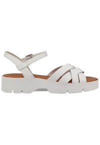 Białe skórzane sandały z grubą, texturedową podeszwą i wieloma krzyżującymi się paskami. Regulowany pasek wokół kostki z metalową klamrą. Brązowa wkładka.