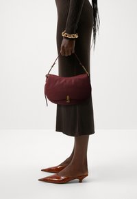 Coccinelle MAGIE SOFT - Borsa a mano - bordeaux