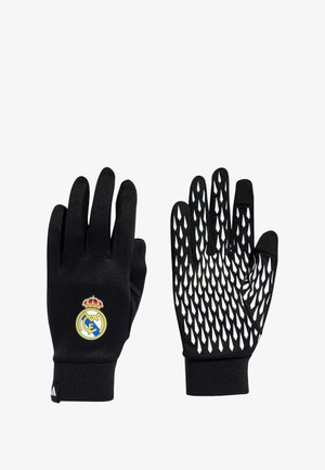 Schwarze Handschuhe mit einem strukturierten weißen Diamantmuster an der Handfläche und einem Real Madrid-Logo auf der Außenseite. Hergestellt aus flexiblem Material.