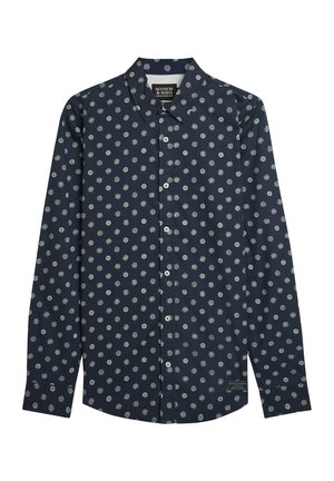 Camicia blu navy a manica lunga con bottoni, con motivi bianchi di sole e cerchi, colletto appuntito e etichetta del marchio vicino all'orlo.