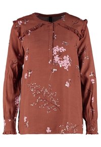Brun långärmad blus med rosa blommönster, volangdetaljer på axlarna och en knappad halsringning. Mjuk tyg med samlade manschetter.