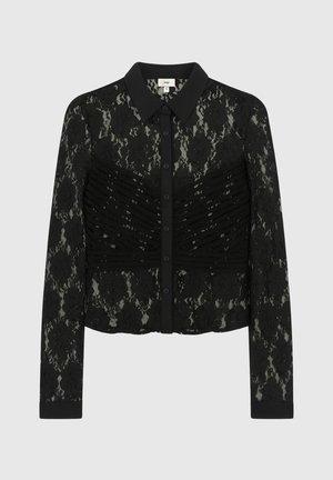 Chemisier en dentelle noire à manches longues, avec un col, une fermeture à boutons et une texture froncée à l'avant. Motif floral sur l'ensemble.