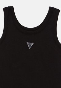 Μαύρο αμάνικο τοπ από μαλακό ύφασμα, με τριγωνικό ασημένιο λογότυπο διακοσμημένο με στρας στην περιοχή του στήθους.