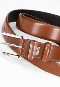 Brown leather belt featuring a silver-tone metal buckle and keeper, with punched holes for adjustment and embossed branding detail.