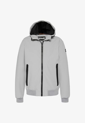 Lys grå jakke med hette, frontglidelås og svarte detaljer. Har to sidelommer med glidelås og elastiske mansjetter. Glatt tekstur.