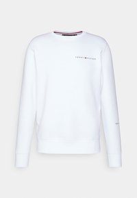 Sweatshirt blanc avec encolure ras du cou et poignets en ribcord. Arbore le logo "TOMMY HILFIGER" en couleurs contrastées sur le devant et la manche.