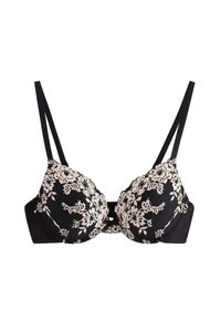 Reggiseno nero con coppe imbottite, caratterizzato da un sovrapposto in pizzo floreale beige. Spalline sottili regolabili e banda in tessuto liscio per supporto.