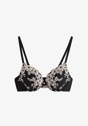 Sort bh med polstrede kopper, der har et blomsterlacemønster i beige. Justerbare tynde stropper og et glat stofbånd for støtte.