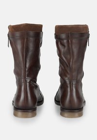 Brown leather ankle boots with a soft brown suede upper, side zipper, and a low tan rubber heel. Smooth texture with subtle stitching details.