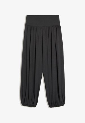 Pantalon noir ample avec une large taille élastique et des poignets élastiques froncés aux chevilles, en tissu doux et fluide.