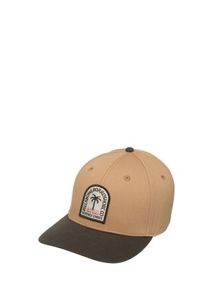 Beige and dark brown baseball cap with a palm tree logo patch reading "Billabong Boardshort Co" on the front panel.