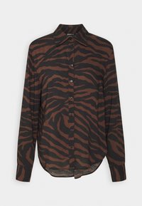 Brown and black long-sleeve shirt featuring a tiger stripe pattern, collar, and button-down front. Soft fabric with a relaxed fit.