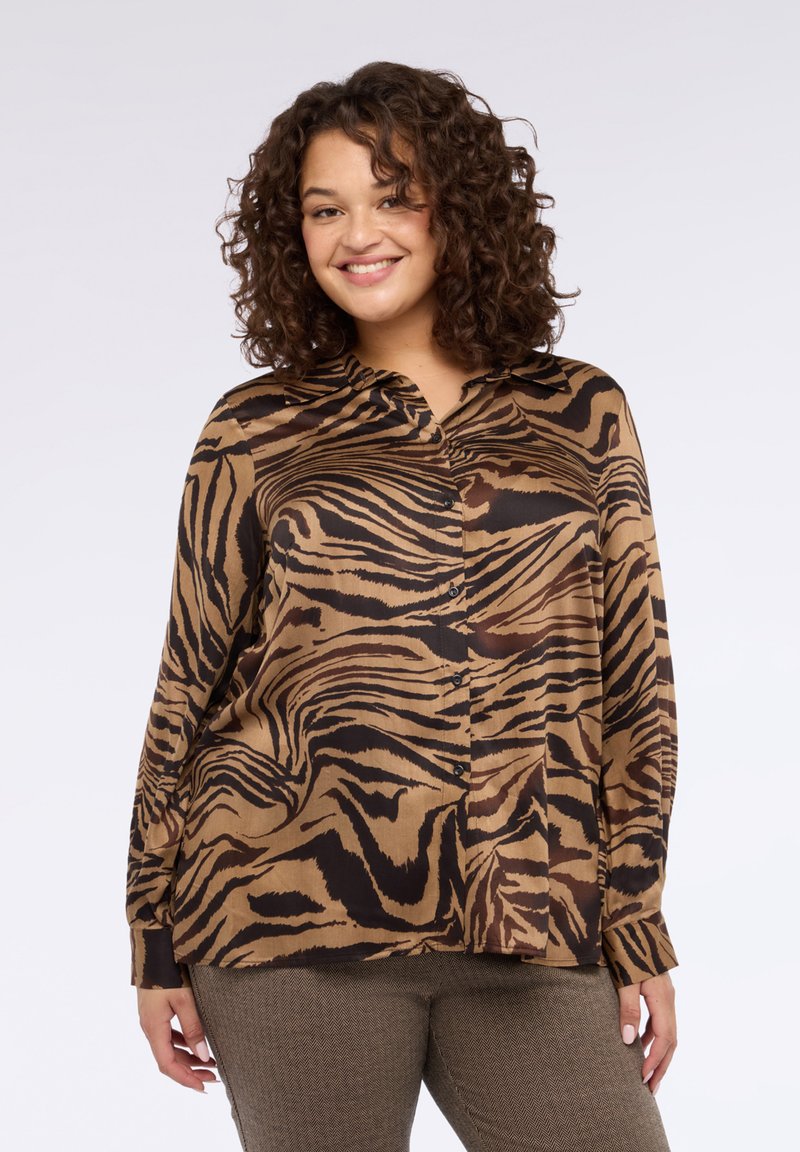 Camicia a righe marroni e nere con bottoni, colletto, maniche lunghe e vestibilità comoda. Tessuto: liscio, leggero.