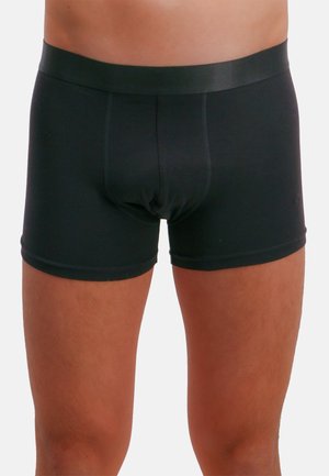 Sorte bomuldsboxershorts med en glat elastisk linning og tætsiddende design, der har flade sømme og en længde til midt på låret.