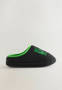 Black slipper with a green interior and a textured graphic design on the upper. Soft fabric material and cushioned sole for comfort.