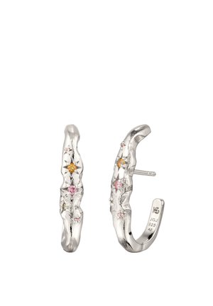 Silver hoop earrings with a textured surface, decorated with small colored gemstones including pink and yellow, one earring shows a post backing.