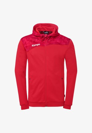 Red zip-up hoodie with geometric pattern on shoulders, front pockets, and "Kempa" logo on left chest.