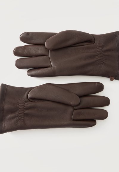 Paire de gants en cuir marron foncé avec un détail élastique au poignet, posés à plat avec les paumes vers le haut sur un fond clair.