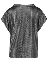 Schwarze kurzärmlige Bluse mit einem strukturierten Zickzackmuster und einer lockeren, kastigen Passform.