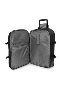 Valise noire à roulettes avec poignée télescopique ouverte montrant deux compartiments avec poches en filet et en tissu zippées à l'intérieur.