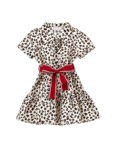 Leopard print dress in cotton fabric, featuring a collared neckline, short sleeves, and a tiered skirt, cinched with a red ribbon belt.