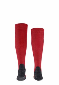 Calze fino al ginocchio di un vivace rosso con un motivo a maglia testurizzata. Sezioni del tallone e della punta rinforzate in nero. Bordo a costine nella parte superiore.